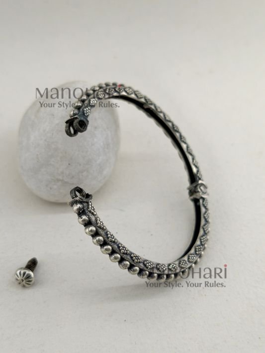 **Aarohi Heritage Silver Bangle crafted from premium brass with an elegant oxidised silver-plated finish, featuring a vintage-inspired openable design and a comfortable 6 cm inner diameter for timeless ethnic elegance.**