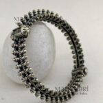 **Aaranya Vintage Silver Bangle crafted from premium brass with a refined silver-plated finish, featuring a vintage-inspired openable design and a comfortable 5.5 cm inner diameter for timeless ethnic elegance.**