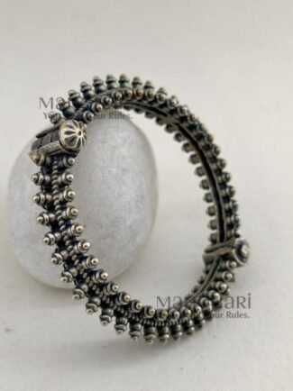 **Aaranya Vintage Silver Bangle crafted from premium brass with a refined silver-plated finish, featuring a vintage-inspired openable design and a comfortable 5.5 cm inner diameter for timeless ethnic elegance.**