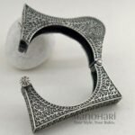 **Zehra Tribal Silver Bangle crafted from premium brass with an elegant oxidised silver-look finish, featuring a traditional Afghani tribal design, adjustable openable style, and a comfortable 5.5 cm inner diameter for timeless ethnic elegance.**