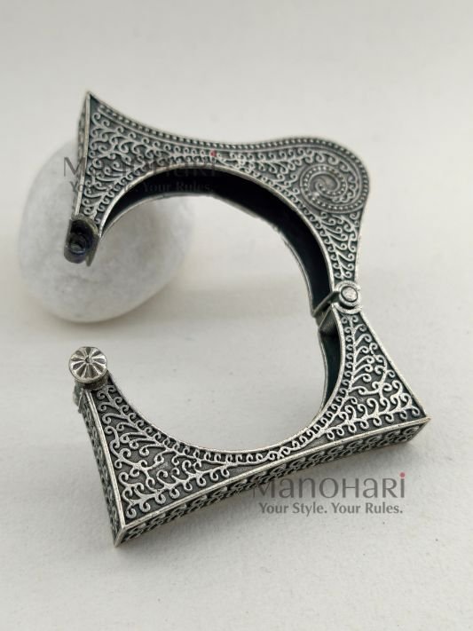 **Zehra Tribal Silver Bangle crafted from premium brass with an elegant oxidised silver-look finish, featuring a traditional Afghani tribal design, adjustable openable style, and a comfortable 5.5 cm inner diameter for timeless ethnic elegance.**