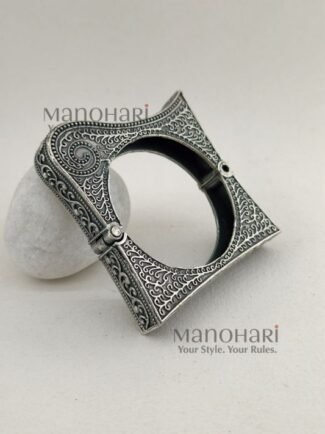 **Zehra Tribal Silver Bangle crafted from premium brass with an elegant oxidised silver-look finish, featuring a traditional Afghani tribal design, adjustable openable style, and a comfortable 5.5 cm inner diameter for timeless ethnic elegance.**