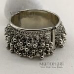 **Aarvi Silver Ghungroo Bracelet crafted from premium alloy metal with an elegant silver-tone finish, featuring delicate ghungroo detailing, an openable fold-over clasp, and a comfortable 6 cm inner diameter, perfect for festive and ethnic styling.**