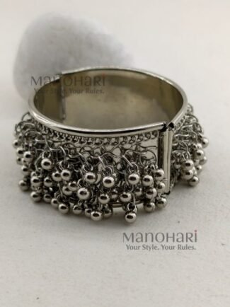 **Aarvi Silver Ghungroo Bracelet crafted from premium alloy metal with an elegant silver-tone finish, featuring delicate ghungroo detailing, an openable fold-over clasp, and a comfortable 6 cm inner diameter, perfect for festive and ethnic styling.**