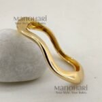 **Vihana Luxe Statement Bangles crafted from premium anti-tarnish stainless steel with a luxurious gold-tone finish, featuring a bold asymmetrical openable cuff design and a 6 cm inner diameter for a modern, elegant statement look.**