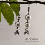 Ghungroo ball drop earrings with two spherical hanging balls and traditional ghungroo detailing for women