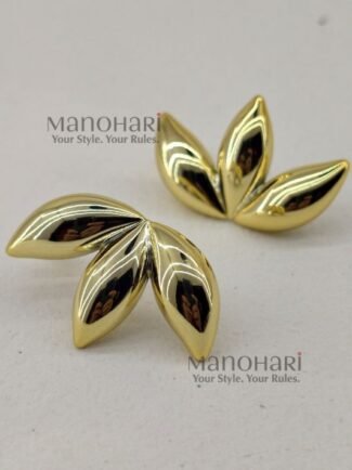 **Aarna Petal Drop Earrings are a perfect blend of modern sophistication and floral-inspired elegance. Expertly crafted from **premium brass** with a radiant **gold-tone finish**, these statement earrings feature graceful **petal-shaped drops** with a smooth, polished surface that beautifully reflects light. Their lightweight design ensures exceptional comfort, making them ideal for all-day wear without compromising on style. Whether paired with **Kerala Kasavu sarees, silk sarees, kurtis, dresses, co-ord sets, or Indo-western outfits**, these elegant earrings effortlessly enhance both casual and festive looks. Perfect for **Onam, weddings, brunches, office wear, parties, receptions, date nights, and everyday styling**, the **Aarna Petal Drop Earrings** are exclusively curated by **Manohari Style** to bring timeless floral charm, premium craftsmanship, and understated luxury to every jewellery collection.**