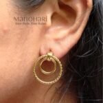 Haya Spiral Hoop Earrings with two twisted gold spiral hoops and one plain loop in an anti-tarnish finish