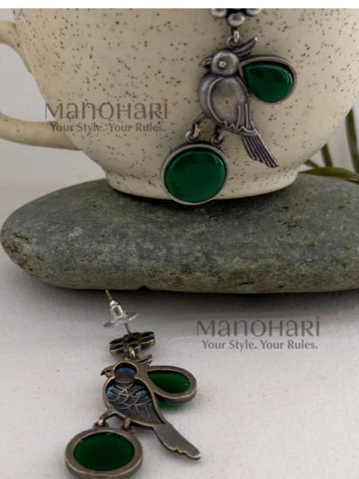 Navya Monalisa Garden 5.5 cm oxidised brass stud earrings with floral and bird motif for women