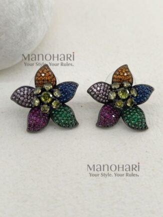 Elara Rainbow Bloom multicolor AD stud earrings with artificial colorful stones, black rhodium polished brass base and 3 cm floral design for women