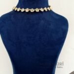 Navya Gold Kundan Grace jewellery set with high gold polish and artificial Kundan-style stones on a brass base for women