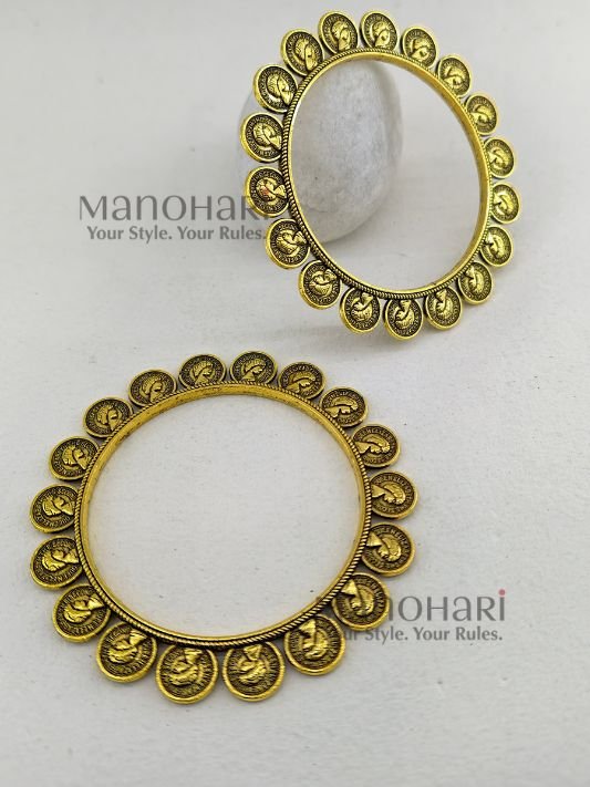 **Svara Dual Tone Heritage Kada Pair crafted in an elegant oxidised metal and golden-tone finish, featuring a heritage-inspired Banjara and Boho Chic design with a comfortable 5.5 cm inner diameter and a secure non-openable fit for timeless ethnic styling.**