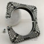 **Aaradhya Temple Stone Cuff Kada featuring a vintage stone-studded design with a classic temple-inspired look, elegant cuff style, and comfortable 5.5 cm inner diameter, perfect for festive and ethnic wear.**