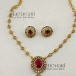 Nivya Crystal Elegance AD necklace with sparkling artificial stones, premium brass design and matching earrings for women