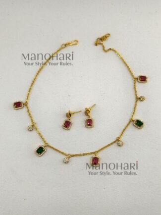 Aaradhya Floral AD layered necklace set with matte gold-plated finish, floral design and rectangular stone accents for women
