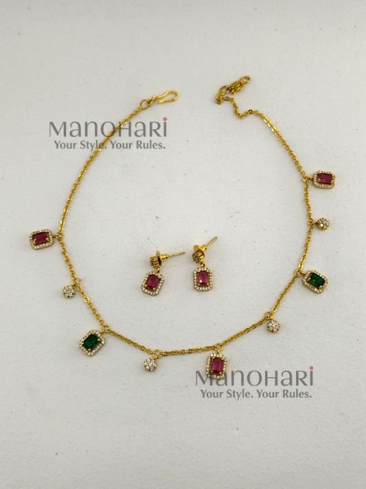 Aaradhya Floral AD layered necklace set with matte gold-plated finish, floral design and rectangular stone accents for women