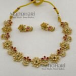 **Ira Royal Heritage Necklace Set crafted from premium brass with a luxurious gold finish, adorned with sparkling artificial stones, featuring an elegant traditional neckpiece and matching earrings for weddings, festive occasions, and timeless ethnic styling.**