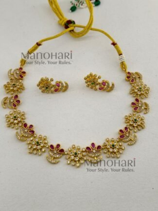 **Ira Royal Heritage Necklace Set crafted from premium brass with a luxurious gold finish, adorned with sparkling artificial stones, featuring an elegant traditional neckpiece and matching earrings for weddings, festive occasions, and timeless ethnic styling.**