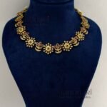 **Ira Royal Heritage Necklace Set crafted from premium brass with a luxurious gold finish, adorned with sparkling artificial stones, featuring an elegant traditional neckpiece and matching earrings for weddings, festive occasions, and timeless ethnic styling.**