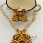 **Vaidehi Ruby Heritage Haram crafted from premium copper brass, adorned with vibrant Ruby Green Kemp stones and elegant pearl drops, featuring a 29 cm traditional Muthyala Haram with matching 4 cm push-back earrings for weddings, festive occasions, and timeless South Indian styling.**