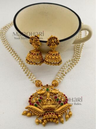 **Vaidehi Ruby Heritage Haram crafted from premium copper brass, adorned with vibrant Ruby Green Kemp stones and elegant pearl drops, featuring a 29 cm traditional Muthyala Haram with matching 4 cm push-back earrings for weddings, festive occasions, and timeless South Indian styling.**