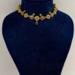 **Morika Peacock Heritage Necklace crafted from a premium alloy metal base with a luxurious gold-plated antique finish, adorned with vibrant Kemp-inspired stones, AD/CZ accents, Kundan-style detailing, pearls, and decorative beads, featuring an elegant peacock motif with matching earrings for timeless bridal and festive elegance.**