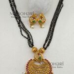 Morika Peacock Royale Necklace Set featuring a traditional peacock-inspired brass design, elegant black bead chain, 27 cm necklace, and matching 3 cm earrings for festive and ethnic wear.