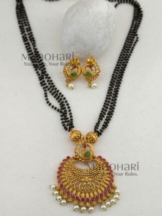 Morika Peacock Royale Necklace Set featuring a traditional peacock-inspired brass design, elegant black bead chain, 27 cm necklace, and matching 3 cm earrings for festive and ethnic wear.