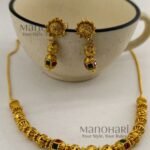 **Vaidehi Temple Beaded Necklace Set crafted from premium brass, adorned with vibrant artificial stones and multicolour beads, featuring an elegant 18 cm temple-inspired necklace with an adjustable extensible chain and matching 4 cm earrings for timeless ethnic elegance.**