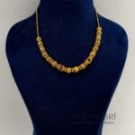 **Vaidehi Temple Beaded Necklace Set crafted from premium brass, adorned with vibrant artificial stones and multicolour beads, featuring an elegant 18 cm temple-inspired necklace with an adjustable extensible chain and matching 4 cm earrings for timeless ethnic elegance.**