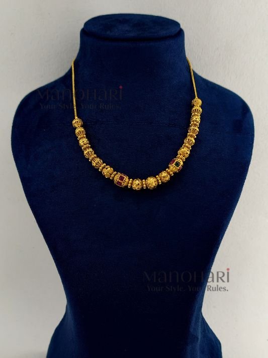 **Vaidehi Temple Beaded Necklace Set crafted from premium brass, adorned with vibrant artificial stones and multicolour beads, featuring an elegant 18 cm temple-inspired necklace with an adjustable extensible chain and matching 4 cm earrings for timeless ethnic elegance.**