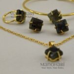 Vanya Natural Stone Gold Royale 4-Piece Jewellery Set featuring a brass gold-plated chain with pendant, ear studs, adjustable bracelet and finger ring with natural stone detailing