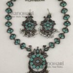 Aadhya Peacock Heritage Oxidised necklace set with mint colour accents, 20 cm chain and 5 cm matching earrings