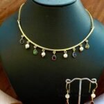 Anvika Multicolor Grace Hasli necklace set with multicolor glass stones, gold polish brass neckpiece, matching earrings and adjustable bangle
