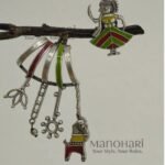 Piya Handpainted Heritage Bloom mismatched stud earrings featuring a girl's face and a colourful toy-inspired design