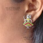 Piya Handpainted Heritage Bloom mismatched stud earrings featuring a girl's face and a colourful toy-inspired design